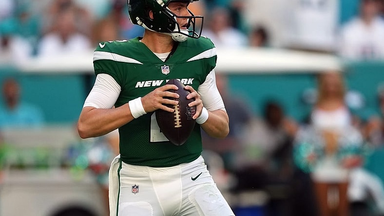 Dec 17, 2023; Miami Gardens, Florida, USA; New York Jets quarterback Zach Wilson (2) drops back to attempt a pass against the Miami Dolphins during the first half at Hard Rock Stadium. Mandatory Credit: Jasen Vinlove-USA TODAY Sports