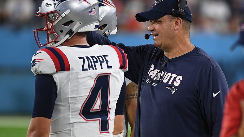Aug 25, 2023; Nashville, Tennessee, USA; New England Patriots offensive coordinator Bill O'Brien talks with quarterback Bailey Zappe (4) during the first half against the Tennessee Titans at Nissan Stadium. Mandatory Credit: Christopher Hanewinckel-USA TODAY Sports