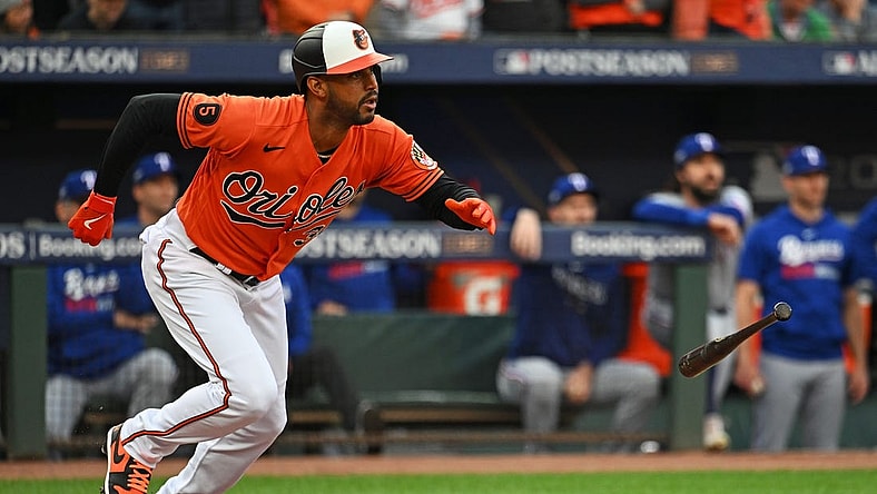 Oct 8, 2023; Baltimore, Maryland, USA; Baltimore Orioles center fielder Aaron Hicks (34) hits a two run RBI during the first inning against the Texas Rangers during game two of the ALDS for the 2023 MLB playoffs at Oriole Park at Camden Yards. Mandatory Credit: Tommy Gilligan-USA TODAY Sports