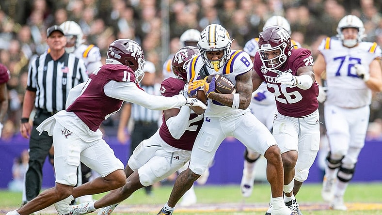 Malik Nabers 8 fights for extra yards as the LSU Tigers take on Texas A&M in Tiger Stadium in Baton Rouge, Louisiana, November 25, 2023.