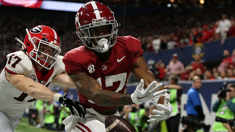Dec 2, 2023; Atlanta, GA, USA; Alabama Crimson Tide wide receiver Isaiah Bond (17) attempts to make a catch against Georgia Bulldogs defensive back Dan Jackson (17) during the first half of the SEC Championship game at Mercedes-Benz Stadium. Mandatory Credit: Brett Davis-USA TODAY Sports
