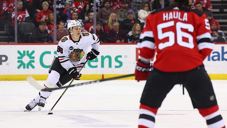 Jan 5, 2024; Newark, New Jersey, USA; Chicago Blackhawks center Connor Bedard (98) skates with the puck against the New Jersey Devils during the first period at Prudential Center. Mandatory Credit: Ed Mulholland-USA TODAY Sports