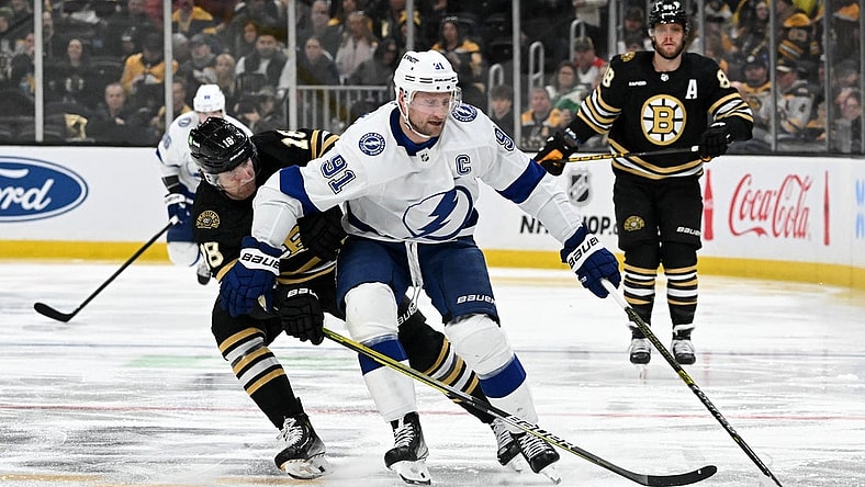 Jan 6, 2024; Boston, Massachusetts, USA; Tampa Bay Lightning center Steven Stamkos (91) controls the puck against Boston Bruins center Pavel Zacha (18) during the second period at the TD Garden. Mandatory Credit: Brian Fluharty-USA TODAY Sports