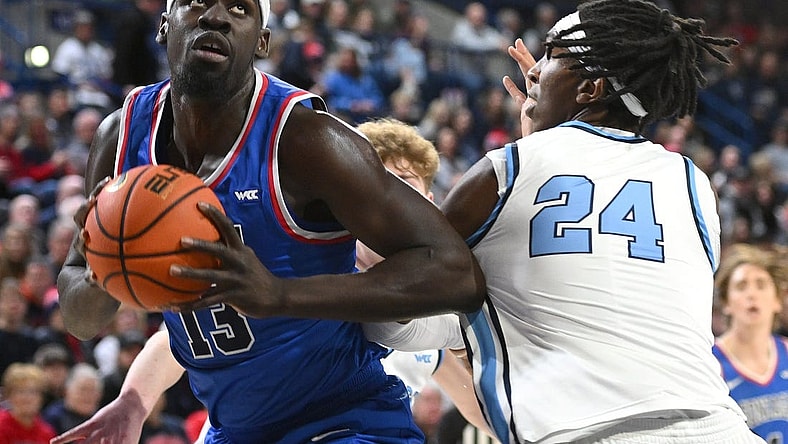 Jan 6, 2024; Spokane, Washington, USA; Gonzaga Bulldogs forward Graham Ike (13) shoots the ball against San Diego Toreros center Steven Jamerson II (24) in the first half at McCarthey Athletic Center. Mandatory Credit: James Snook-USA TODAY Sports
