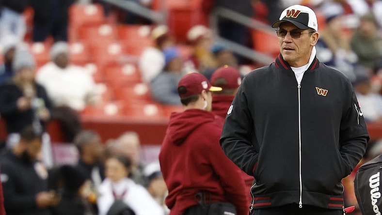 Jan 7, 2024; Landover, Maryland, USA; Washington Commanders head coach Ron Rivera stands on the field during warmups prior to the game against the Dallas Cowboys at FedExField. Mandatory Credit: Geoff Burke-USA TODAY Sports