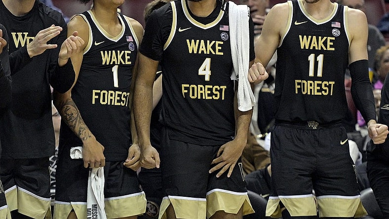 Jan 9, 2024; Tallahassee, Florida, USA; Wake Forest Demon Deacons forwards Marqus Marion (1), Efton Reid III (4), and Andrew Carr (11) react during the second half against the Florida State Seminoles at Donald L. Tucker Center. Mandatory Credit: Melina Myers-USA TODAY Sports