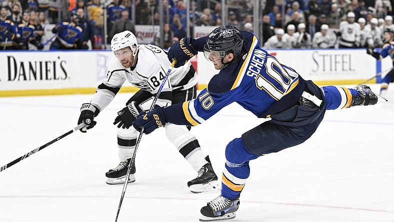 Jan 28, 2024; St. Louis, Missouri, USA; St. Louis Blues center Brayden Schenn (10) takes a shot against the Los Angeles Kings during overtime at Enterprise Center. Mandatory Credit: Jeff Le-USA TODAY Sports