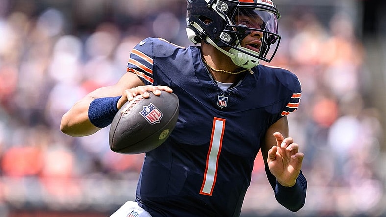 Aug 26, 2023; Chicago, Illinois, USA; Chicago Bears quarterback Justin Fields (1) scrambles against the Buffalo Bills during the first quarter at Soldier Field. Mandatory Credit: Daniel Bartel-USA TODAY Sports