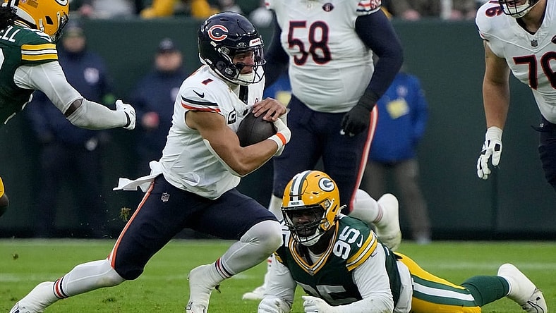 Chicago Bears quarterback Justin Fields (1) runs for q first down during the first quarter of their game against the Green Bay Packers Sunday, January 7, 2024 at Lambeau Field in Green Bay, Wisconsin.Mark Hoffman/Milwaukee Journal Sentinel
