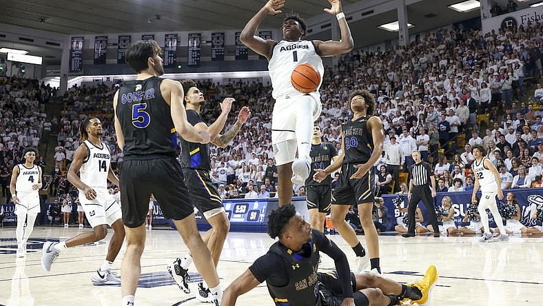 Jan 30, 2024; Logan, Utah, USA; Utah State Aggies forward Great Osobor (1) dunks the ball against the San Jose State Spartans during the second half at Dee Glen Smith Spectrum. Mandatory Credit: Rob Gray-USA TODAY Sports