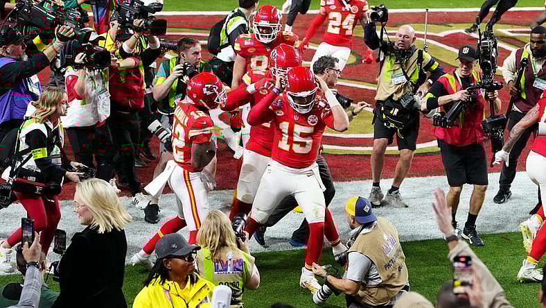 Feb 11, 2024; Paradise, Nevada, USA; Kansas City Chiefs quarterback Patrick Mahomes (15) celebrates after throwing the winning touchdown to wide receiver Mecole Hardman Jr. (12) during overtime against the San Francisco 49ers in Super Bowl LVIII at Allegiant Stadium. Mandatory Credit: Stephen R. Sylvanie-USA TODAY Sports