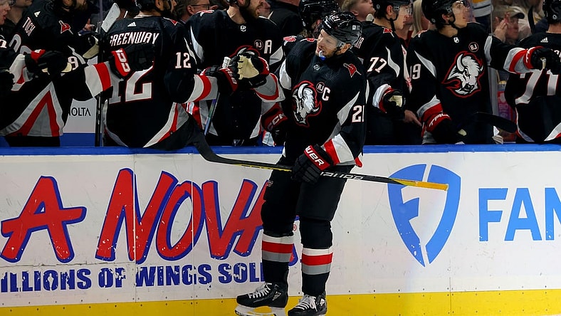 Feb 13, 2024; Buffalo, New York, USA;  Buffalo Sabres right wing Kyle Okposo (21) celebrates his goal with teammates during the first period against the Los Angeles Kings at KeyBank Center. Mandatory Credit: Timothy T. Ludwig-USA TODAY Sports