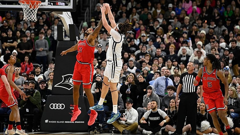 Feb 13, 2024; Providence, Rhode Island, USA; St. John's Red Storm center Joel Soriano (11) defends against Providence Friars forward Josh Oduro (13) during the second half at Amica Mutual Pavilion. Mandatory Credit: Eric Canha-USA TODAY Sports