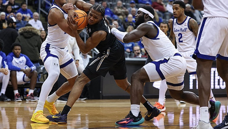 Feb 14, 2024; Newark, New Jersey, USA; Xavier Musketeers guard Quincy Olivari (8) is tied up by Seton Hall Pirates guard Dre Davis (14) and guard Dylan Addae-Wusu (0) during the first half at Prudential Center. Mandatory Credit: Vincent Carchietta-USA TODAY Sports