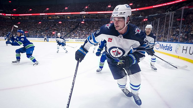Feb 17, 2024; Vancouver, British Columbia, CAN; Winnipeg Jets forward Sean Monahan (23) skates against the Vancouver Canucks in the second period at Rogers Arena. Mandatory Credit: Bob Frid-USA TODAY Sports