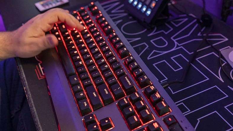 A backlit keyboard is part of the gear online video game streamer Jordan Woodruff uses in his Gilbert home.
Jordan Woodruff