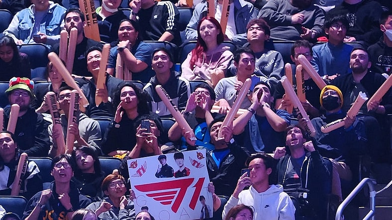 Nov 5, 2022; San Francisco, California, USA; A fan holds a sign for T1 during the League of Legends World Championships against DRX at Chase Center. Mandatory Credit: Kelley L Cox-USA TODAY Sports