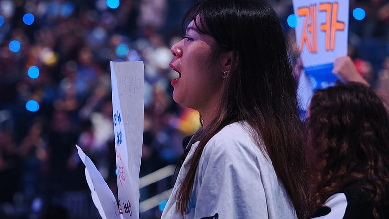 Nov 5, 2022; San Francisco, California, USA; A DRX fan with visible tears after DRX won the League of Legends World Championships against T1 at Chase Center. Mandatory Credit: Kelley L Cox-USA TODAY Sports