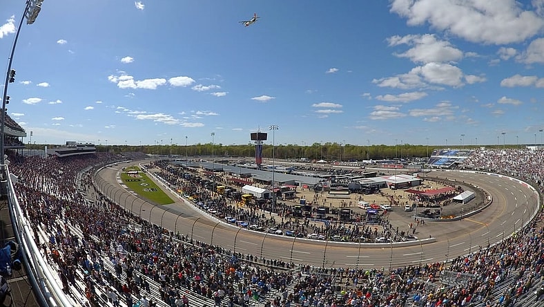 Apr 2, 2023; Richmond, Virginia, USA; A US Coast Guard C-130 performs a flyby before the start of the Toyota Owners 400 in this overall view of Richmond Raceway. Mandatory Credit: John David Mercer-USA TODAY Sports