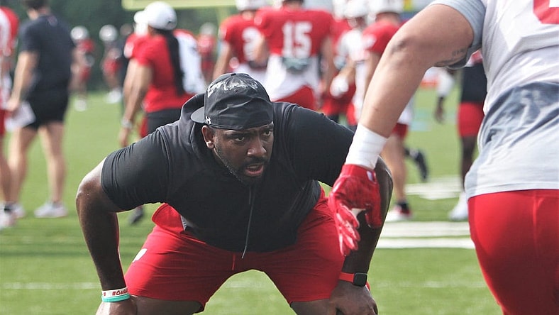 Wisconsin defensive line coach Greg Scruggs watches his players go through drills during practice on Sunday Aug. 6, 2023 at Pioneer Stadium in Platteville, Wis.