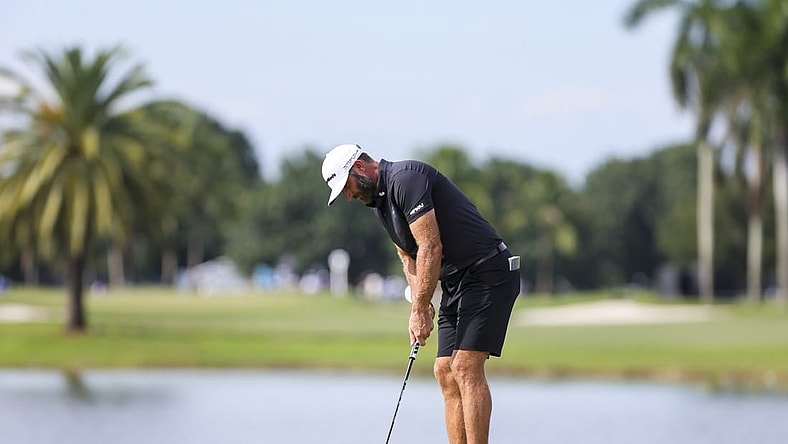 Oct 22, 2023; Doral, Florida, USA; Dustin Johnson putts on the eighth green during the final round of the LIV Golf Miami golf tournament at Trump National Doral. Mandatory Credit: Sam Navarro-USA TODAY Sports
