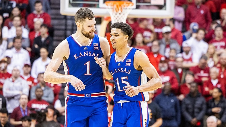 Dec 16, 2023; Bloomington, Indiana, USA; Kansas Jayhawks center Hunter Dickinson (1) and guard Kevin McCullar Jr. (15) celebrate in the second half against the Indiana Hoosiers at Simon Skjodt Assembly Hall. Mandatory Credit: Trevor Ruszkowski-USA TODAY Sports