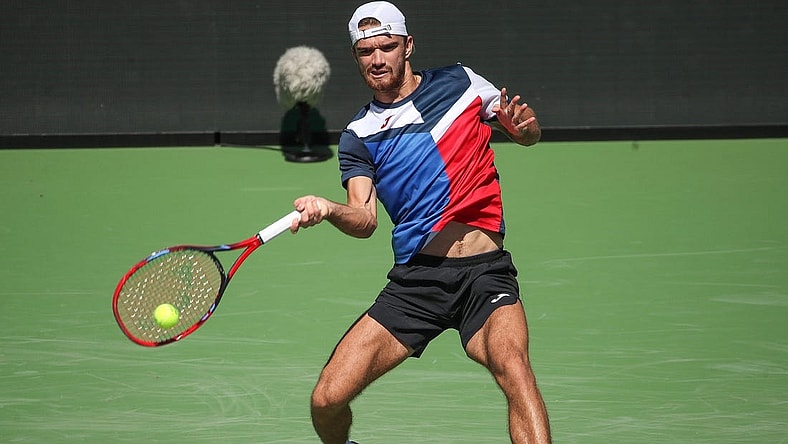 Tomas Machac hits a shot during his match against Stan Wawrinka on Stadium 1 at the BNP Paribas Open in Indian Wells, Calif., Mar. 7, 2024.
