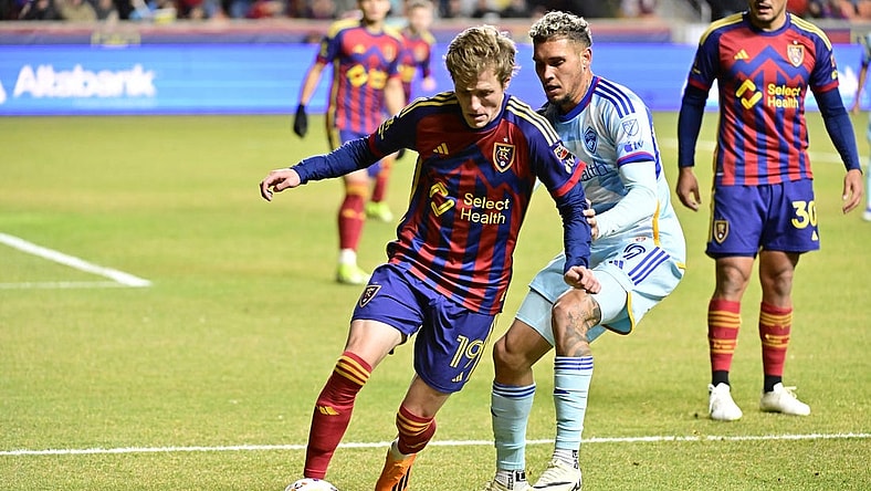 Mar 9, 2024; Sandy, Utah, USA; Real Salt Lake midfielder Bode Hidalgo (19) dribbles the ball against Colorado Rapids forward Rafael Navarro (9) during the first half at America First Field. Mandatory Credit: Christopher Creveling-USA TODAY Sports