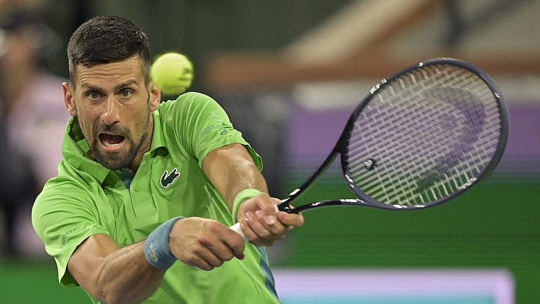 Mar 11, 2024; Indian Wells, CA, USA; Novak Djokovic (SRB) hits a shot in his third round match against Luca Nardi (ITA) in the BNP Paribas Open at the Indian Wells Tennis Garden. Mandatory Credit: Jayne Kamin-Oncea-USA TODAY Sports