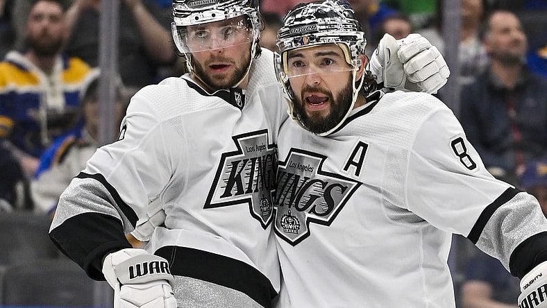 Mar 13, 2024; St. Louis, Missouri, USA;  Los Angeles Kings right wing Adrian Kempe (9) celebrates with defenseman Drew Doughty (8) after scoring against the St. Louis Blues during the third period at Enterprise Center. Mandatory Credit: Jeff Curry-USA TODAY Sports