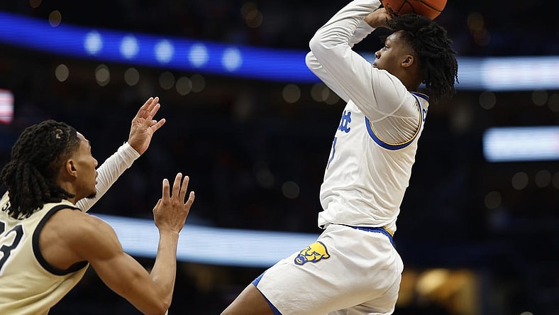Mar 14, 2024; Washington, D.C., USA; Pittsburgh Panthers guard Carlton Carrington (7) shoots the ball as Wake Forest Demon Deacons guard Hunter Sallis (23) in the first half at Capital One Arena. Mandatory Credit: Geoff Burke-USA TODAY Sports