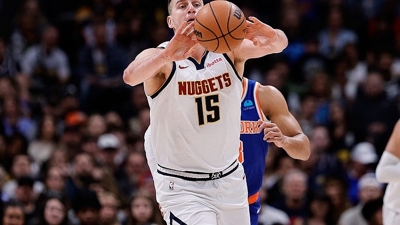 Mar 21, 2024; Denver, Colorado, USA; Denver Nuggets center Nikola Jokic (15) passes the ball in the first quarter against the New York Knicks at Ball Arena. Mandatory Credit: Isaiah J. Downing-USA TODAY Sports