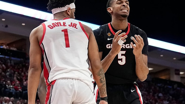 Mar 26, 2024; Columbus, OH, USA; Georgia Bulldogs center Frank Anselem-Ibe (5) reacts to a missed rebound beside Ohio State Buckeyes guard Roddy Gayle Jr. (1) during the first half of the NIT quarterfinals at Value City Arena.