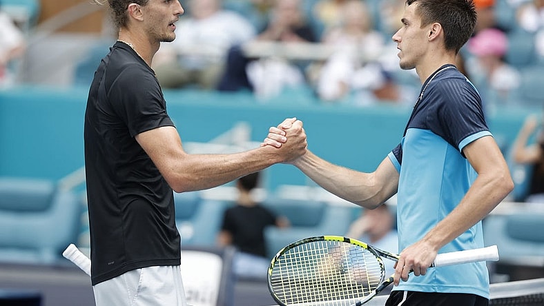 Mar 28, 2024; Miami Gardens, FL, USA; Alexander Zverev (GER) (L) shakes hands with Fabian Marozsan (HUN) (R) after their match on day eleven of the Miami Open at Hard Rock Stadium. Mandatory Credit: Geoff Burke-USA TODAY Sports