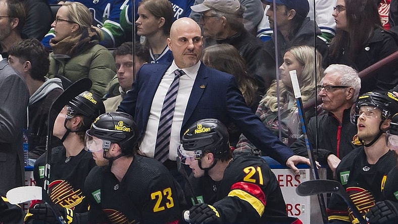 Feb 15, 2024; Vancouver, British Columbia, CAN; Vancouver Canucks head coach Rick Tocchet on the bench against the Detroit Red Wings in the first period at Rogers Arena. Mandatory Credit: Bob Frid-USA TODAY Sports