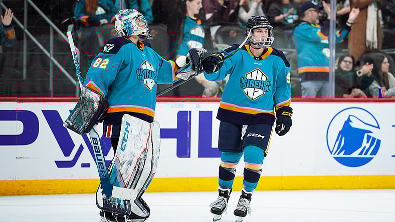 New York Sirens forward Kristyna Kaltounkova fist bumps goalie Kayle Osborne