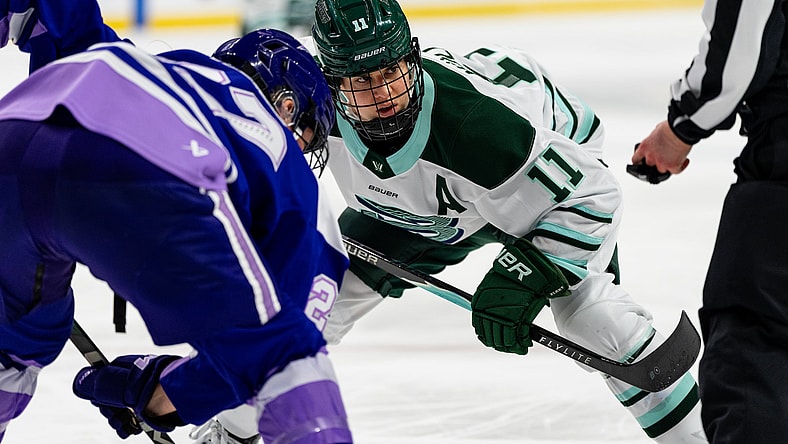 Boston Fleet forward Alina Müller takes a face-off against Minnesota Frost forward Taylor Heise.