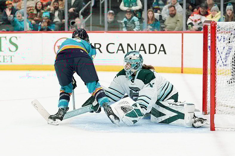 Boston Fleet goalie Aerin Frankel makes a save on New York Sirens forward Elle Hartje.