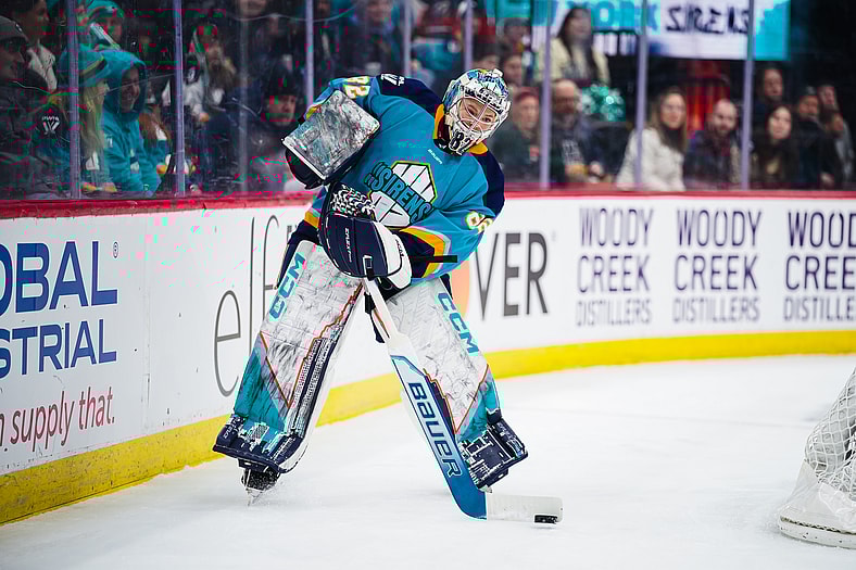 New York Sirens goalie Kayle Osborne plays the puck outside the crease.