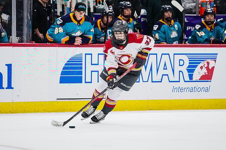 Ottawa Charge forward Rebecca Leslie carries the puck against the New York Sirens.