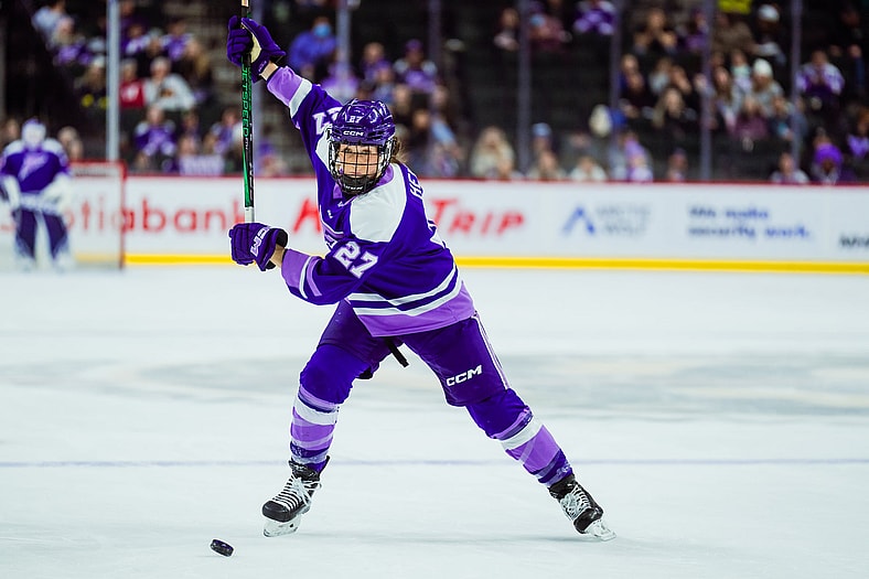 Minnesota Frost forward Taylor Heise winds up for a slap shot against the Vancouver Goldeneyes.
