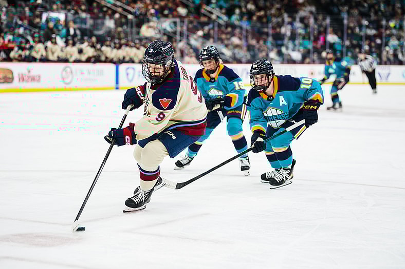 New York Sirens forward Sarah Fillier chases Montreal Victoire defender Kati Tabin.
