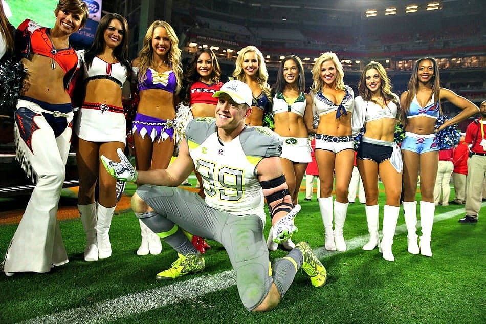 Jan 25, 2015; Phoenix, AZ, USA; Team Carter defensive end J.J. Watt of the Houston Texans (99) poses with the NFL cheerleaders after the 2015 Pro Bowl at University of Phoenix Stadium. Mandatory Credit: Mark J. Rebilas-USA TODAY Sports