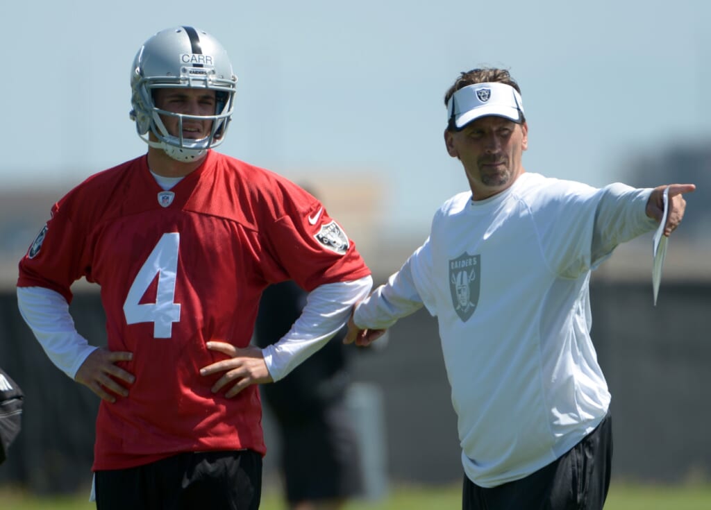 May 16, Alameda, CA, USA; Oakland Raiders quarterback Derek Carr (4) and offensive coordinator Greg Olson at rookie minicamp at the Raiders practice facility. Mandatory Credit: Kirby Lee-USA TODAY Sports