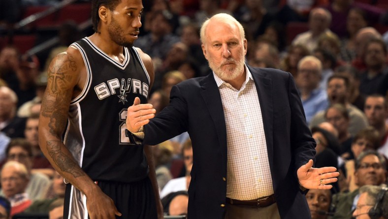 Gregg Popovich talks to Kawhi Leonard