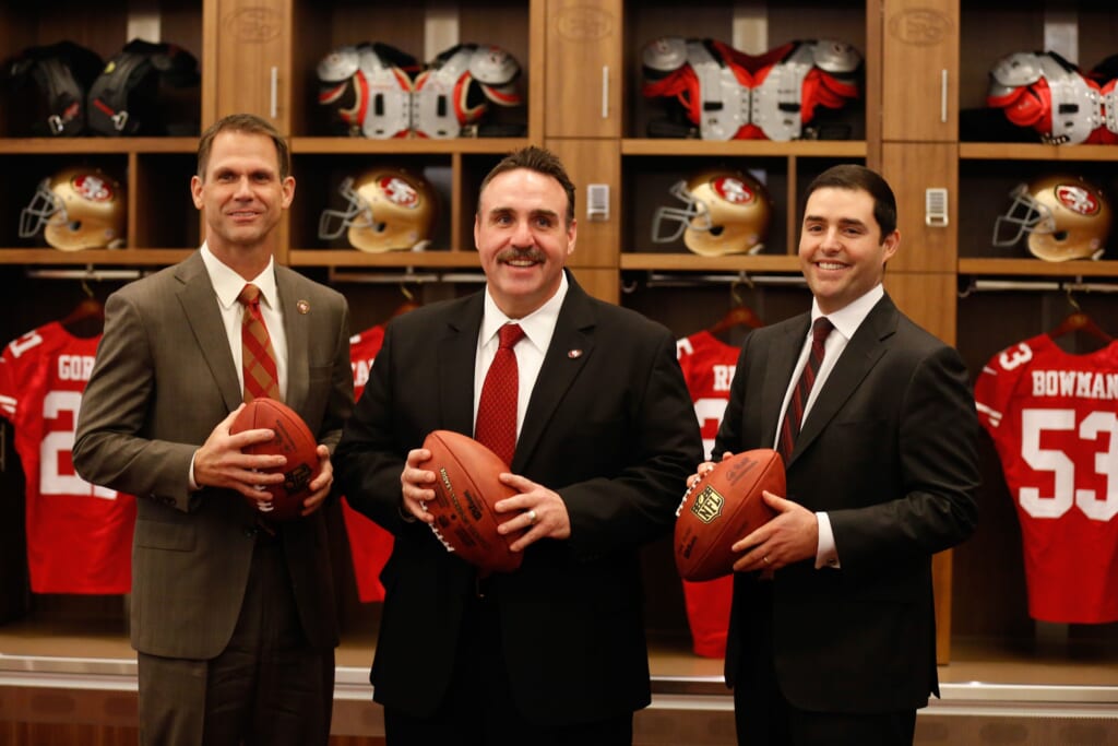 Jan 15, 2015; Santa Clara, CA, USA; San Francisco 49ers general manager Trent Baalke (L), head coach Jim Tomsula (C), and owner Jed York (R) pose for a photo in the locker room after a press conference for the introduction of Tomsula as the head coach at Levi's Stadium Auditorium. Mandatory Credit: Kelley L Cox-USA TODAY Sports