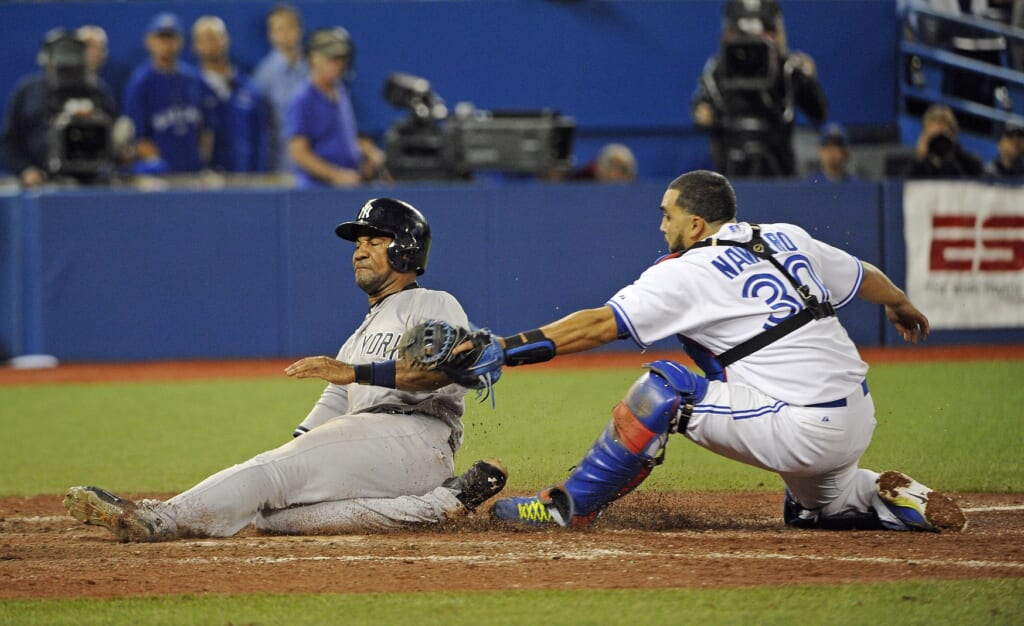 Sep 22, 2015; Toronto, Ontario, CAN; Toronto Blue Jays catcher Dioner Navarro (30) tags out New York Yankees pinch hitter Chris Young (24) in the ninth inning at Rogers Centre. Mandatory Credit: Peter Llewellyn-USA TODAY Sports