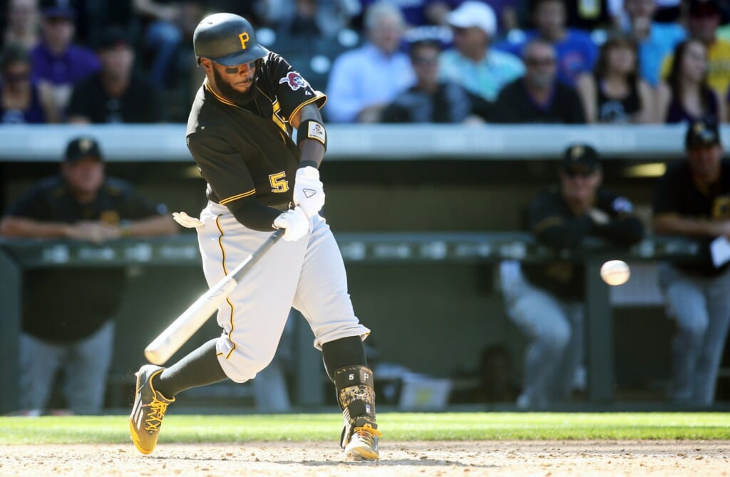 Sep 24, 2015; Denver, CO, USA; Pittsburgh Pirates third baseman Josh Harrison (5) hits a double during the seventh inning against the Colorado Rockies at Coors Field. The Pirates won 5-4. Mandatory Credit: Chris Humphreys-USA TODAY Sports