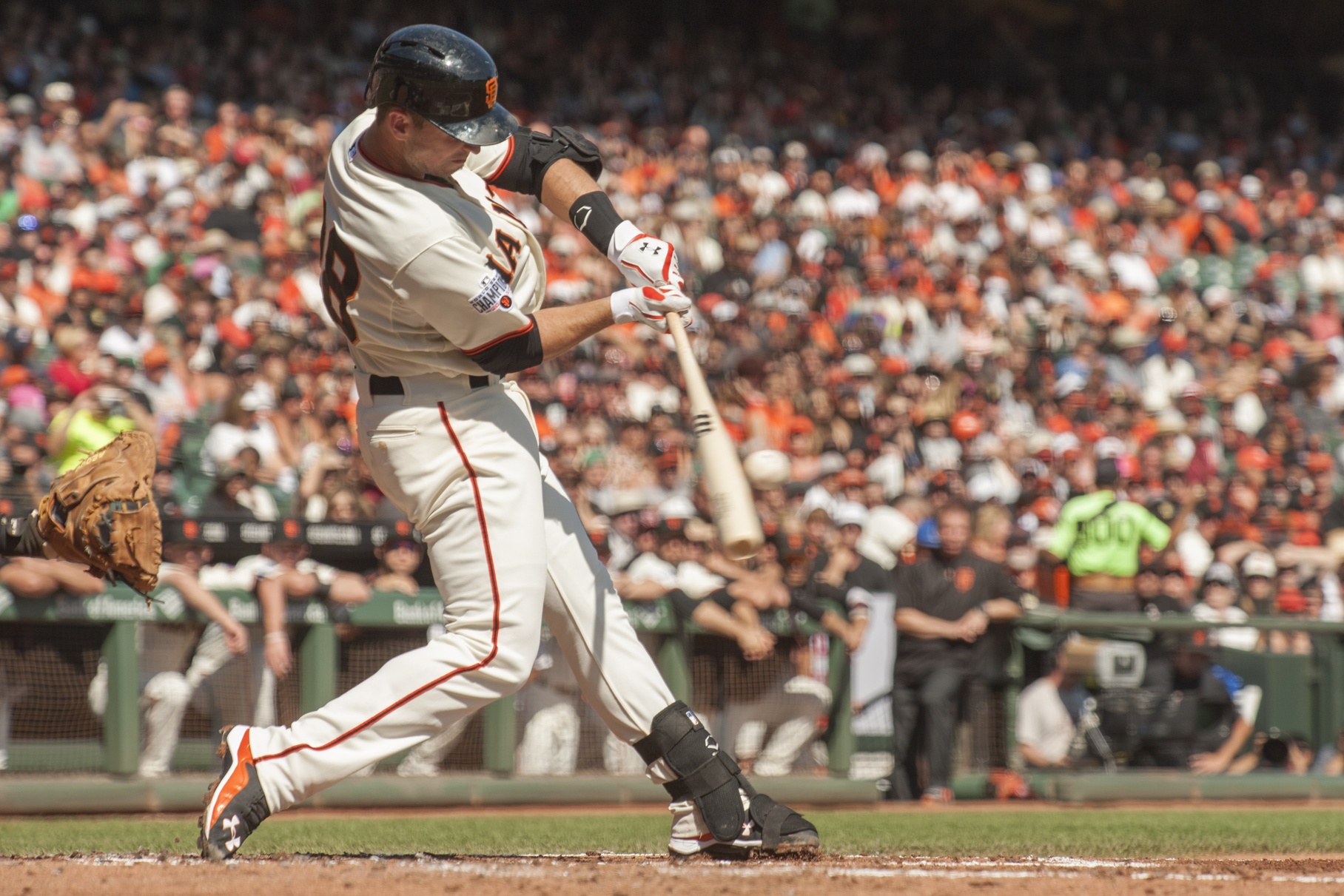 Oct 4, 2015; San Francisco, CA, USA; San Francisco Giants catcher Buster Posey (28) hits an RBI single against the Colorado Rockies during the first inning at AT&T Park. Mandatory Credit: Ed Szczepanski-USA TODAY Sports
