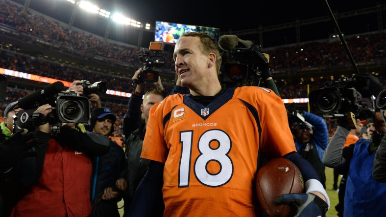 Jan 3, 2016; Denver, CO, USA; Denver Broncos quarterback Peyton Manning (18) celebrates winning following the game against the San Diego Chargers at Sports Authority Field at Mile High. The Broncos defeated the Chargers 27-20. Mandatory Credit: Ron Chenoy-USA TODAY Sports